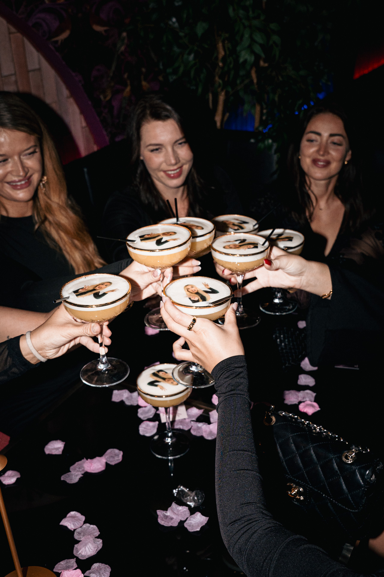 Guests toasting over espresso martinis.