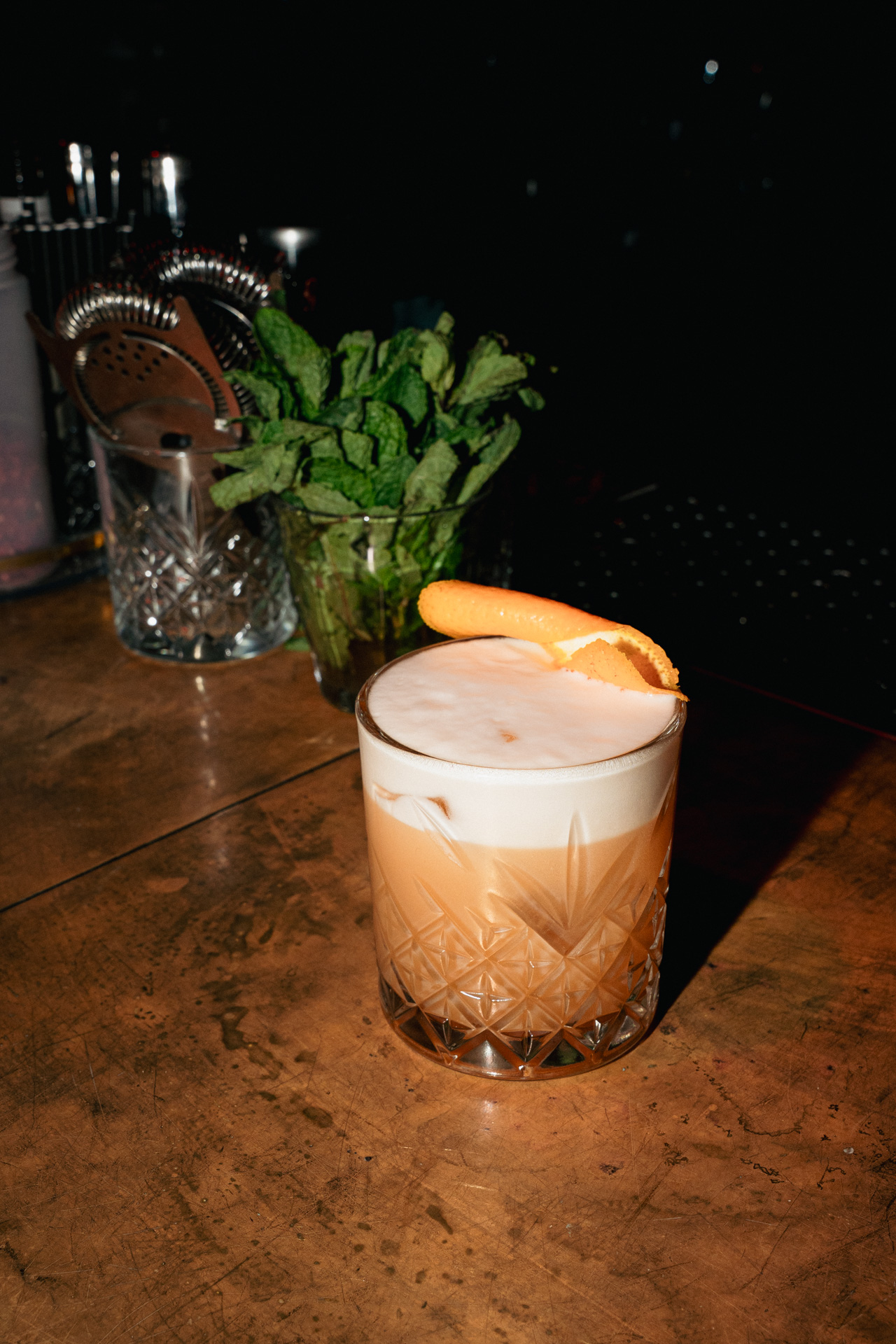 A whisky sour finished with a citrus twist.