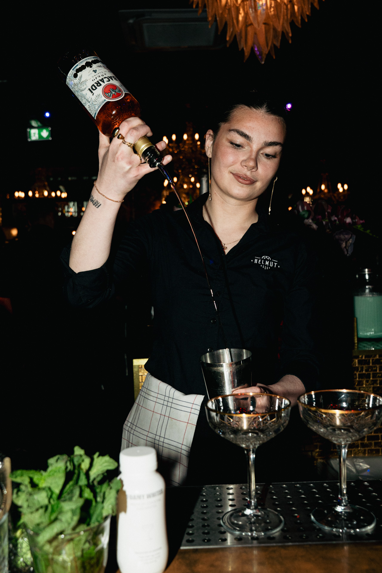 Building a round of drinks at the bar.