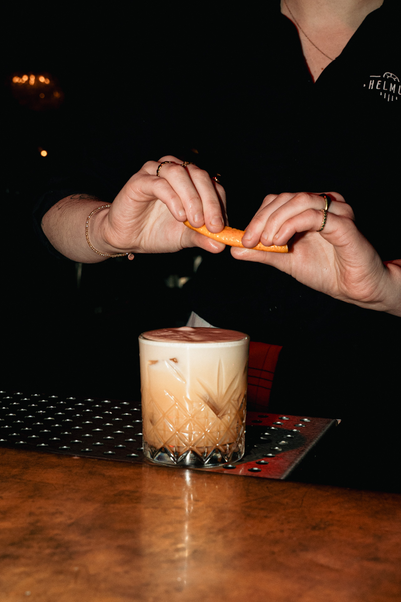 A citrus twist expressed over a fresh sour.